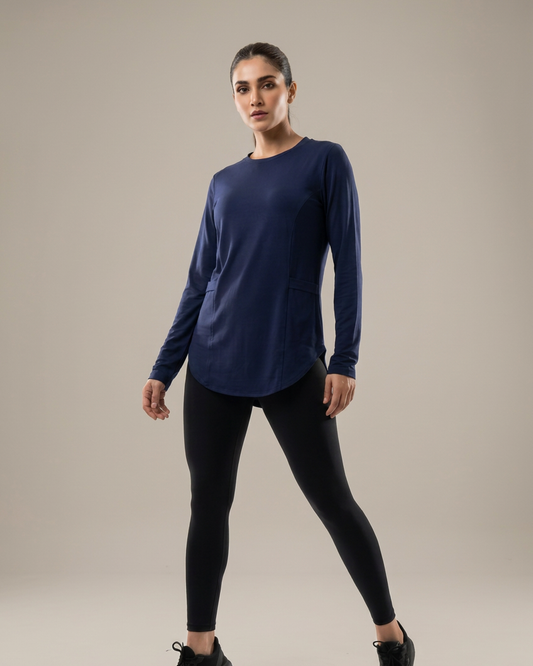 Navy – Jenna long sleeve athletic top with double pockets, full-length view, wide stance