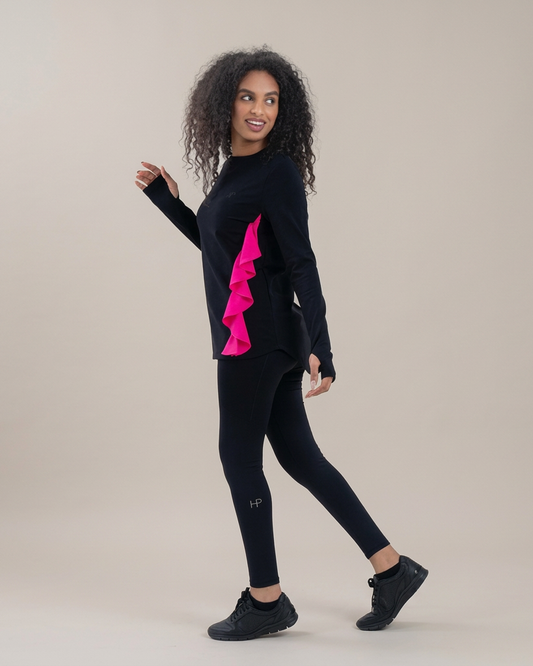 Black – Syah long modest top with wave panel design, full-length view in motion