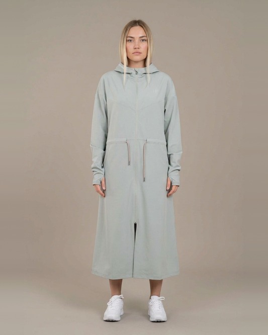 Green Mist – Syra lightweight long jacket with adjustable waist, front view with hood down