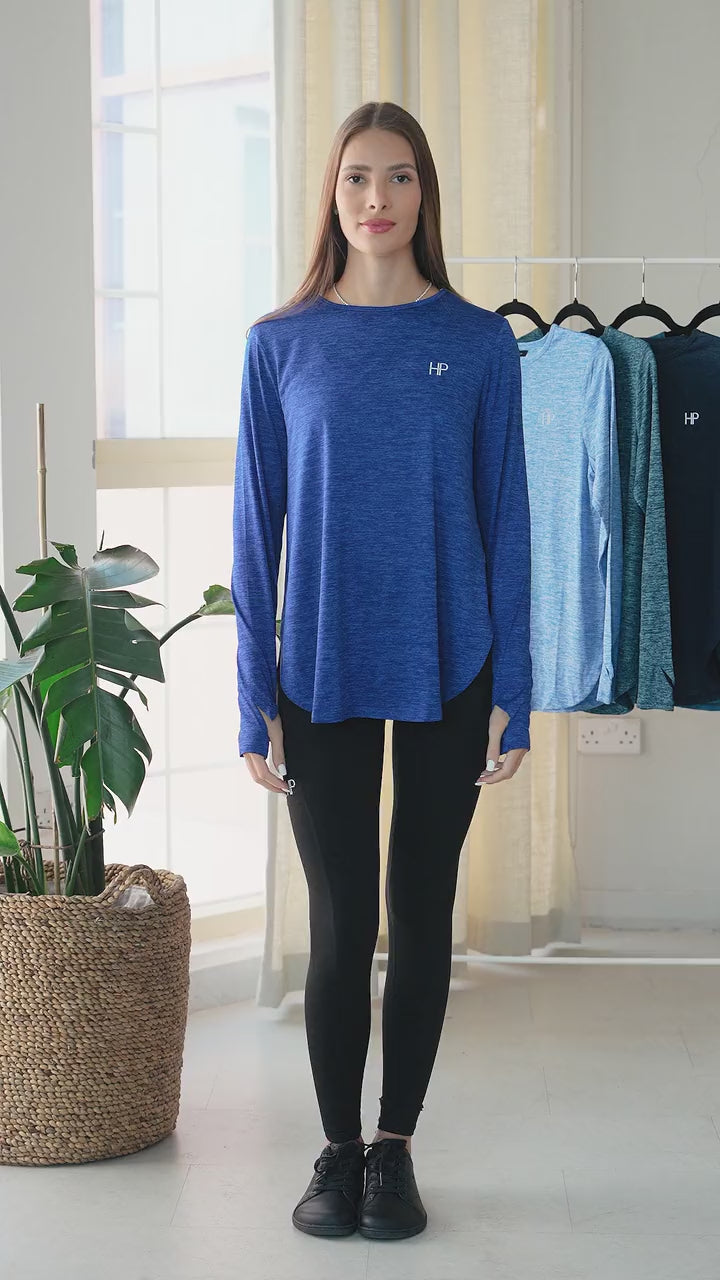 Video: Adeela long modest top in shades of blue, shown on the model